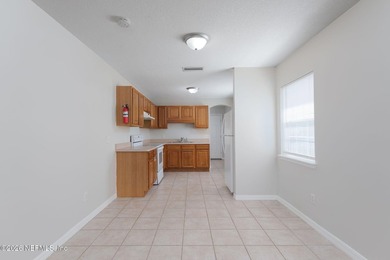 This charming cottage-style home with 3 beds + 2 baths is - photo 8