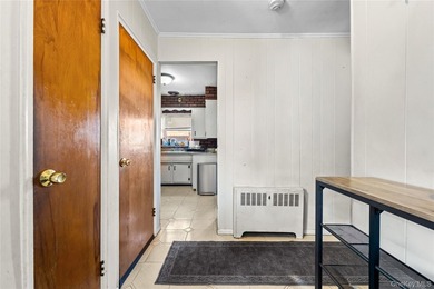 Welcome home to this inviting brick semi-attached single-family - photo 4
