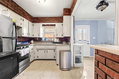 Welcome home to this inviting brick semi-attached single-family - photo 5