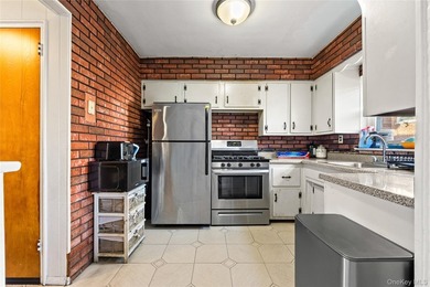 Welcome home to this inviting brick semi-attached single-family - photo 6