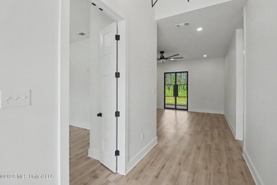 Welcome to this stunning custom-built 2025 home, where modern - photo 4