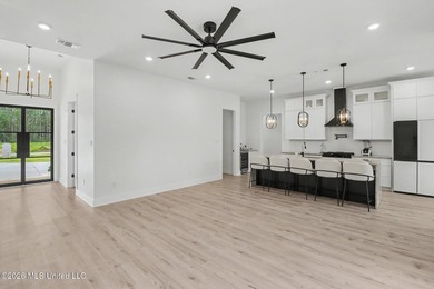 Welcome to this stunning custom-built 2025 home, where modern - photo 7