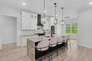 Welcome to this stunning custom-built 2025 home, where modern - photo 8
