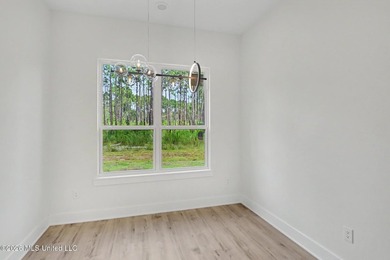 Welcome to this stunning custom-built 2025 home, where modern - photo 10