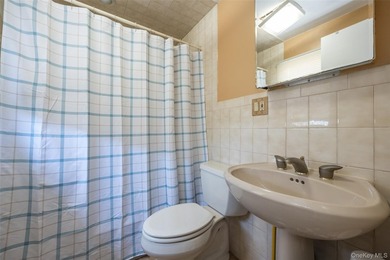 Deceptive from the outside, this expanded Colonial home offers - photo 12