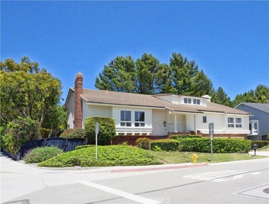 Situated on a quiet street overlooking a lush greenbelt in the - photo 2