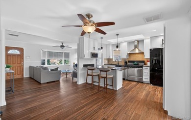 Welcome to this beautifully maintained waterfront ranch in the