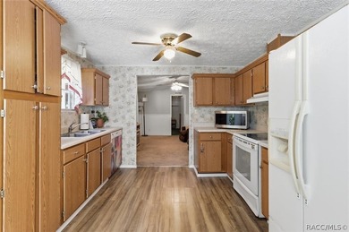 Framed by a canopy of mature trees and lush landscaping, this - photo 11