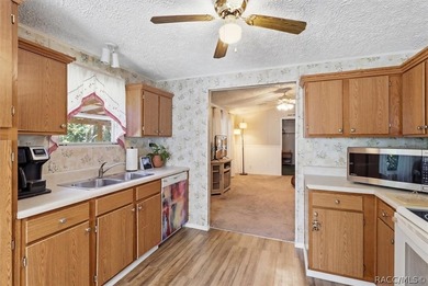 Framed by a canopy of mature trees and lush landscaping, this - photo 13