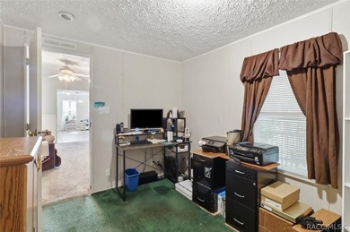 Framed by a canopy of mature trees and lush landscaping, this - photo 23