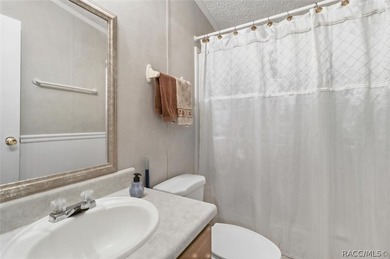 Framed by a canopy of mature trees and lush landscaping, this - photo 24