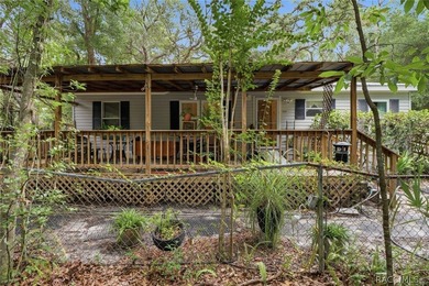 Framed by a canopy of mature trees and lush landscaping, this - photo 38
