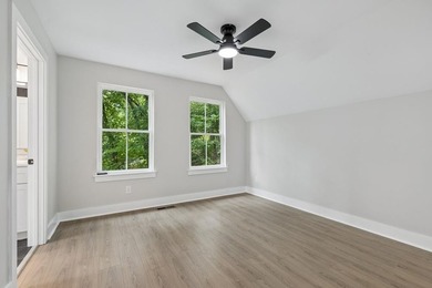 Nestled among mature trees in a desirable Center Hill Lake gated - photo 26