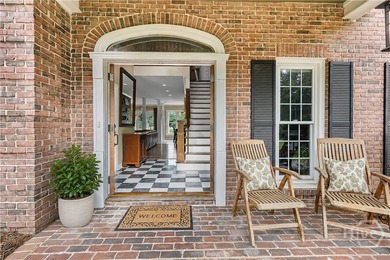 Welcome to 3 Pine Lakes Point, a stately all-brick traditional - photo 3
