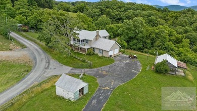 Nestled on 17 breathtaking acres, this enchanting 1910 farmhouse - photo 3