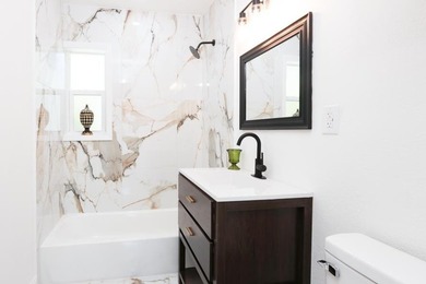 Step into a home where *renovated* is an understatement-it's - photo 14
