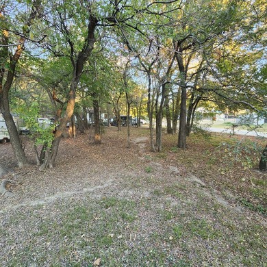 Wooded corner lot available in a lakefront community on Lake - photo 3