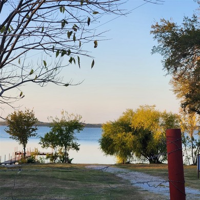 Wooded corner lot available in a lakefront community on Lake - photo 7