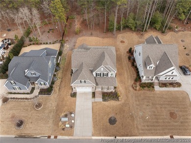 Pristine 2024 Mid-South Club home on an elevated lot with thick - photo 3