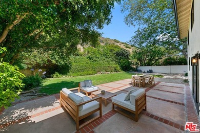 Nestled on a rare private flat lot along Sicomoro Drive in the - photo 45