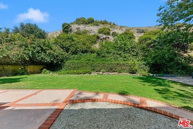 Nestled on a rare private flat lot along Sicomoro Drive in the - photo 46