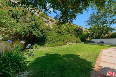 Nestled on a rare private flat lot along Sicomoro Drive in the - photo 47