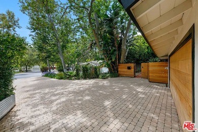 Nestled on a rare private flat lot along Sicomoro Drive in the - photo 49