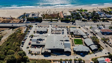 Nestled on a rare private flat lot along Sicomoro Drive in the - photo 50