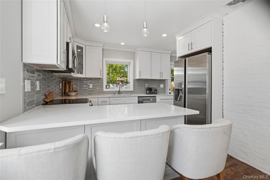 Welcome to this beautifully updated sprawling ranch in the - photo 16