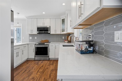 Welcome to this beautifully updated sprawling ranch in the - photo 17