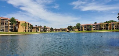 Discover this delightful first-floor unit in the sought-after - photo 2