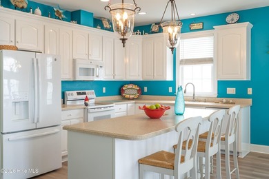 Experience the ultimate in coastal living at this custom-built