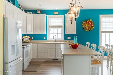 Experience the ultimate in coastal living at this custom-built