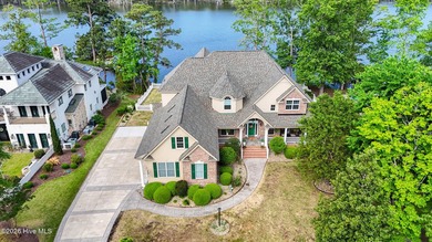 Located in the prestigious, gated waterfront community of - photo 2