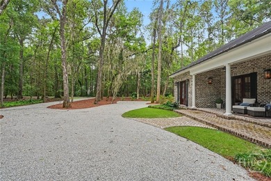 Tucked beneath a canopy of majestic live oaks draped in Spanish - photo 6