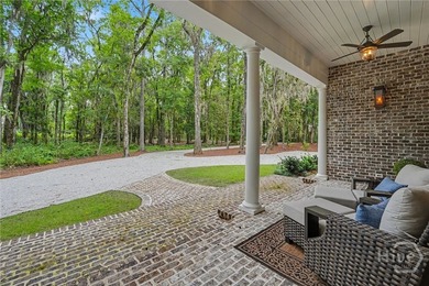 Tucked beneath a canopy of majestic live oaks draped in Spanish - photo 8