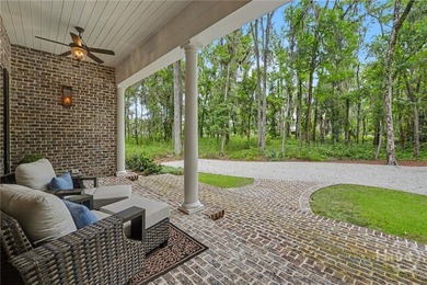 Tucked beneath a canopy of majestic live oaks draped in Spanish - photo 9