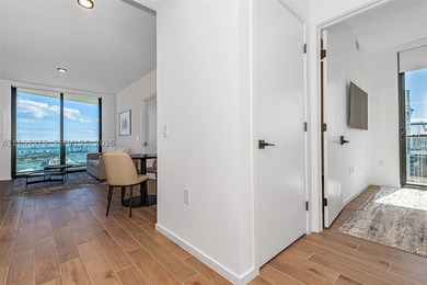 Breathtaking high-floor coastal living awaits in the heart of - photo 5