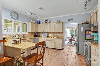 Located in the Marshwood section of The Landings, this - photo 9