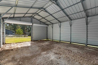 Three lots and a spacious 26x20 metal shop with three roll-up - photo 9