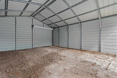 Three lots and a spacious 26x20 metal shop with three roll-up - photo 10