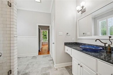 Charming and beautifully updated, this Old Mandeville gem is