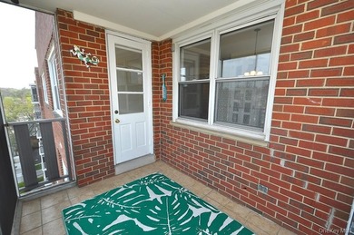 Perched on the top-floor corner, this sun-drenched 2-bedroom - photo 13