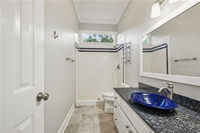 Charming and beautifully updated, this Old Mandeville gem is