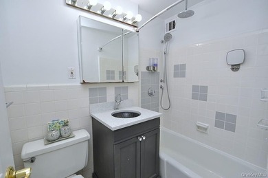 Perched on the top-floor corner, this sun-drenched 2-bedroom - photo 32