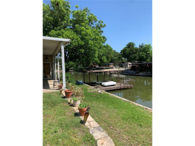 This is an estate sale. Being sold AS IS. Waterfront 2 bedroom 1 - Lake Home For Sale in Granbury, Texas