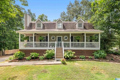 Discover tranquility in this charming lake home nestled in the - photo 1