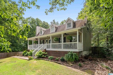 Discover tranquility in this charming lake home nestled in the - photo 3