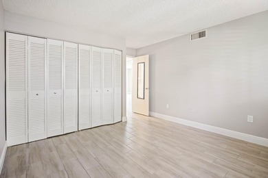 Beautiful 1-bedroom condo featuring updated flooring and a - photo 12