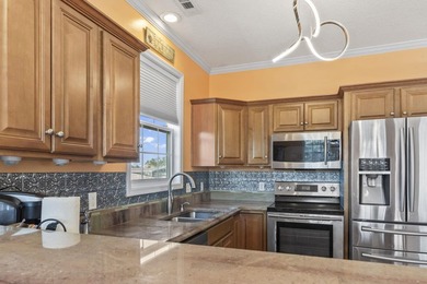 Step into coastal paradise with this exquisite 5-bedroom, 5